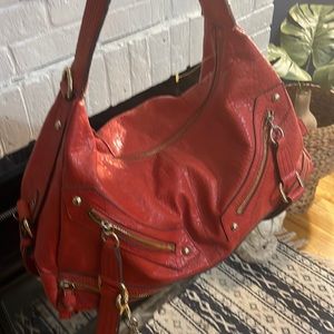 Orange Jessica Simpson bag. Great condition other then the strap side trim shown